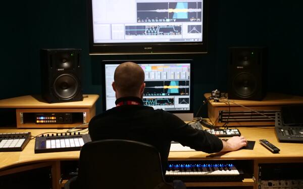 Tutor at Spirit Studios showing how to edit a track channel in Logic.