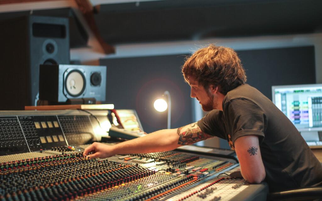 Studio Production and Mastering student using the Neve VR console at Spirit Studios