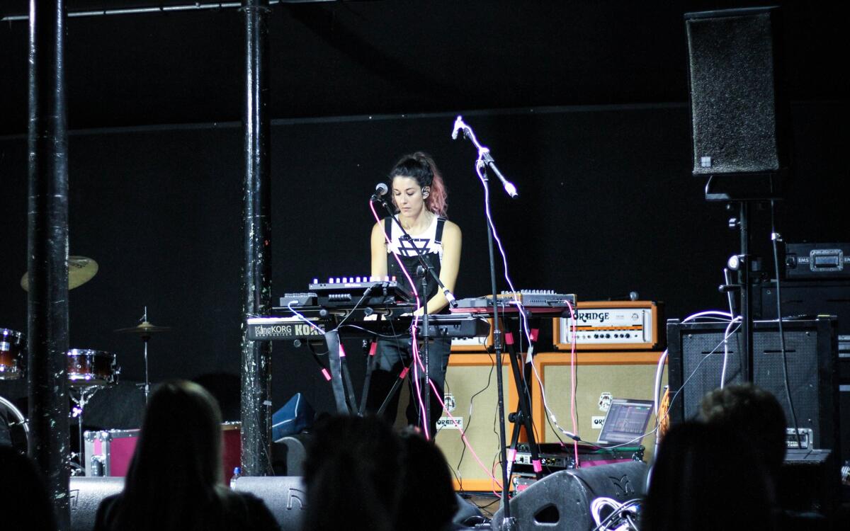 Rachel K Collier performing in the Charlie Jones Live Venue to students on a range of subject areas