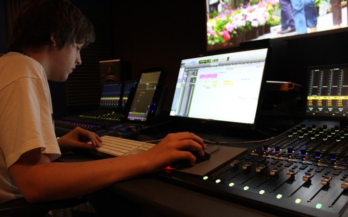 A student from one of our sound engineering courses mixing an audio post production project