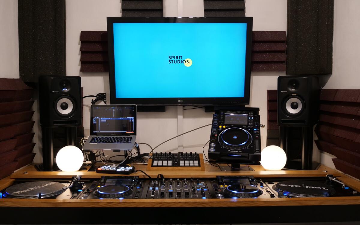 Close up of the pioneer booth with turntables and speakers