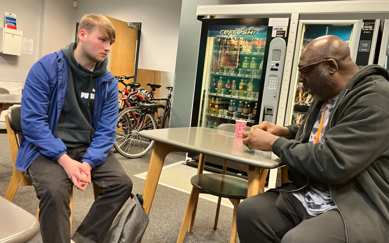 Aniff talking with a Spirit Studios student inside of the green room